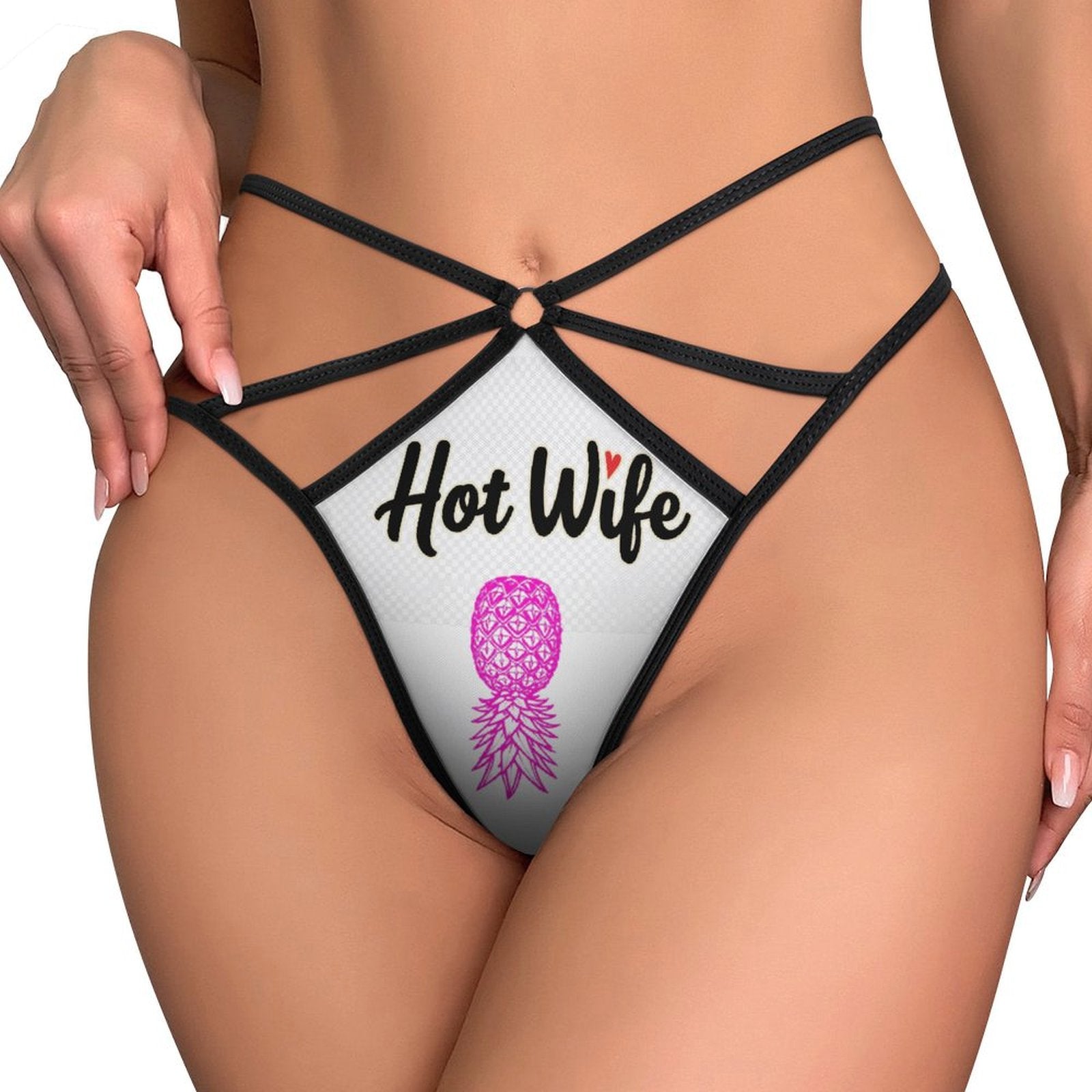 White thong with a pink upside down pineapple with the words "Hot Wife" on them.