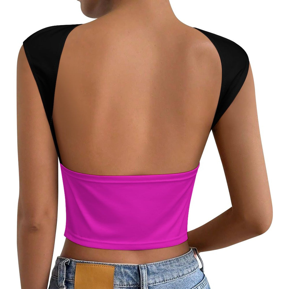A woman shown from the back wearing a bright pink open-back crop top with black shoulder panels, paired with light-wash blue jeans against a plain white background.