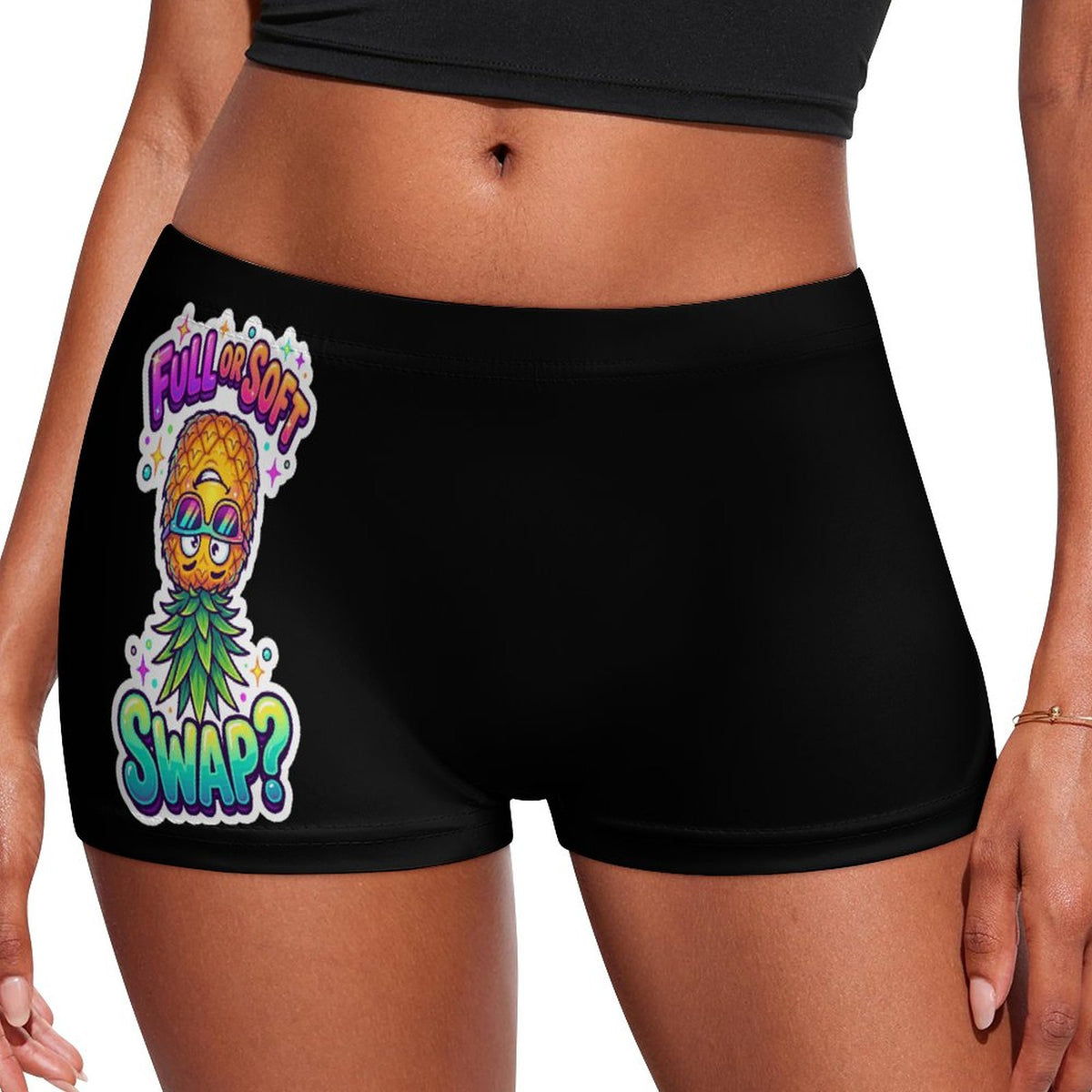Black athletic shorts worn by a model, featuring a colorful graphic of a pineapple character wearing sunglasses with the text 'FULL SOFT SWAP?' in stylized lettering.