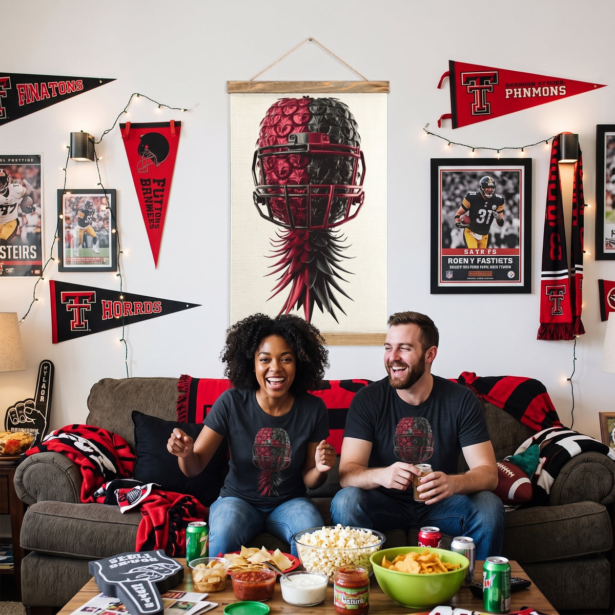 A man and a woman sitting on a couch in a decorated living room, wearing matching black graphic t-shirts with a red football helmet design. The room is covered in Texas football memorabilia, including 'TITANS' and 'TITMONS' pennants, scarves, framed jerseys, and a large vertical wall scroll.