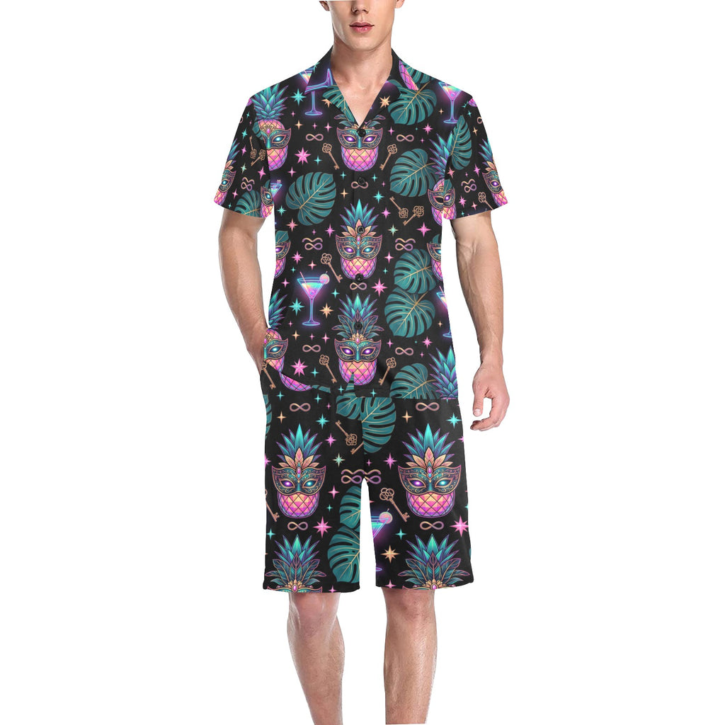 Man wearing a pineapple themed pajama short set with matching short sleeve shirt and shorts.