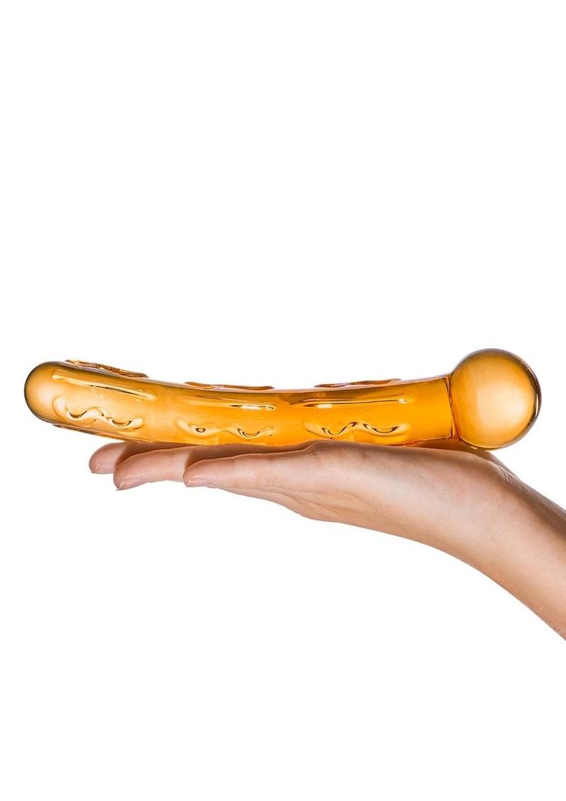Hand holding a yellow toy with a white background