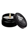 Black candle jar with 'blow me' lid on a white background