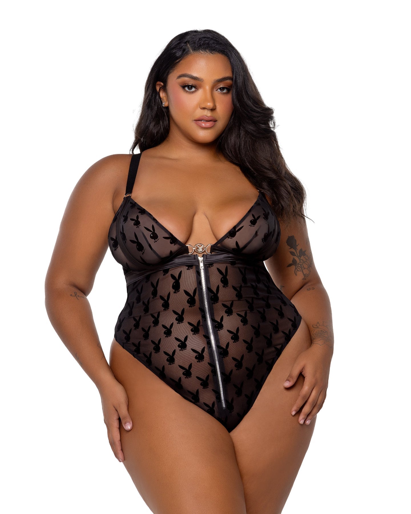 Woman wearing a black lace lingerie set on a white background